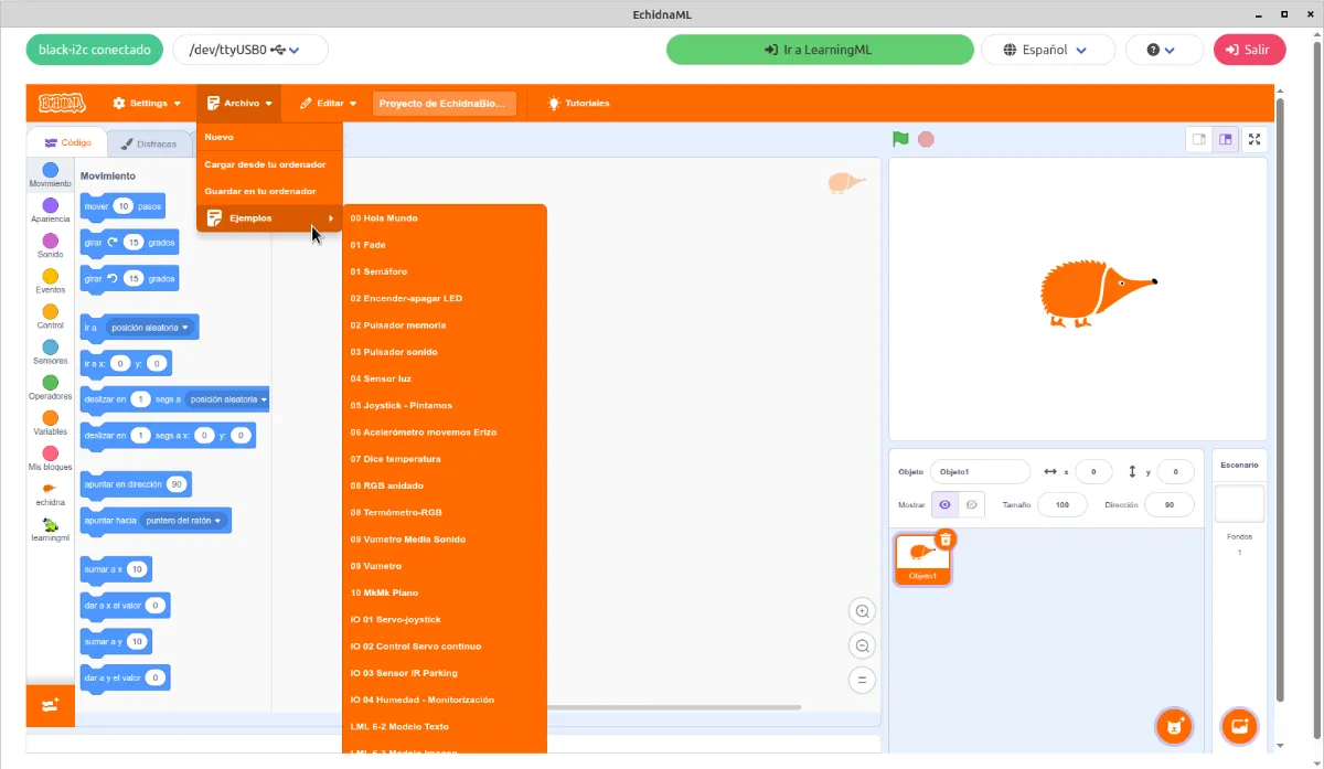 Menú Archivo de EchidnaBlocks abierto, con Nuevo, Cargar desde tu ordenador, Guardar en tu ordenador y el submenú Ejemplos desplegado.